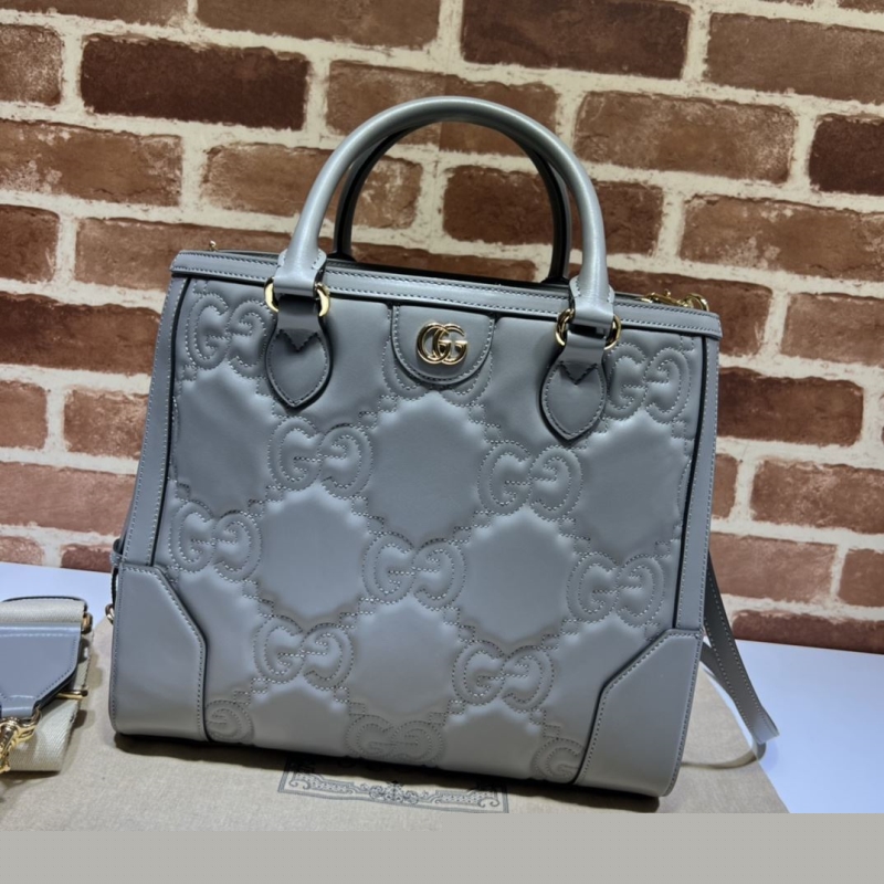 G*u*i shopping bags